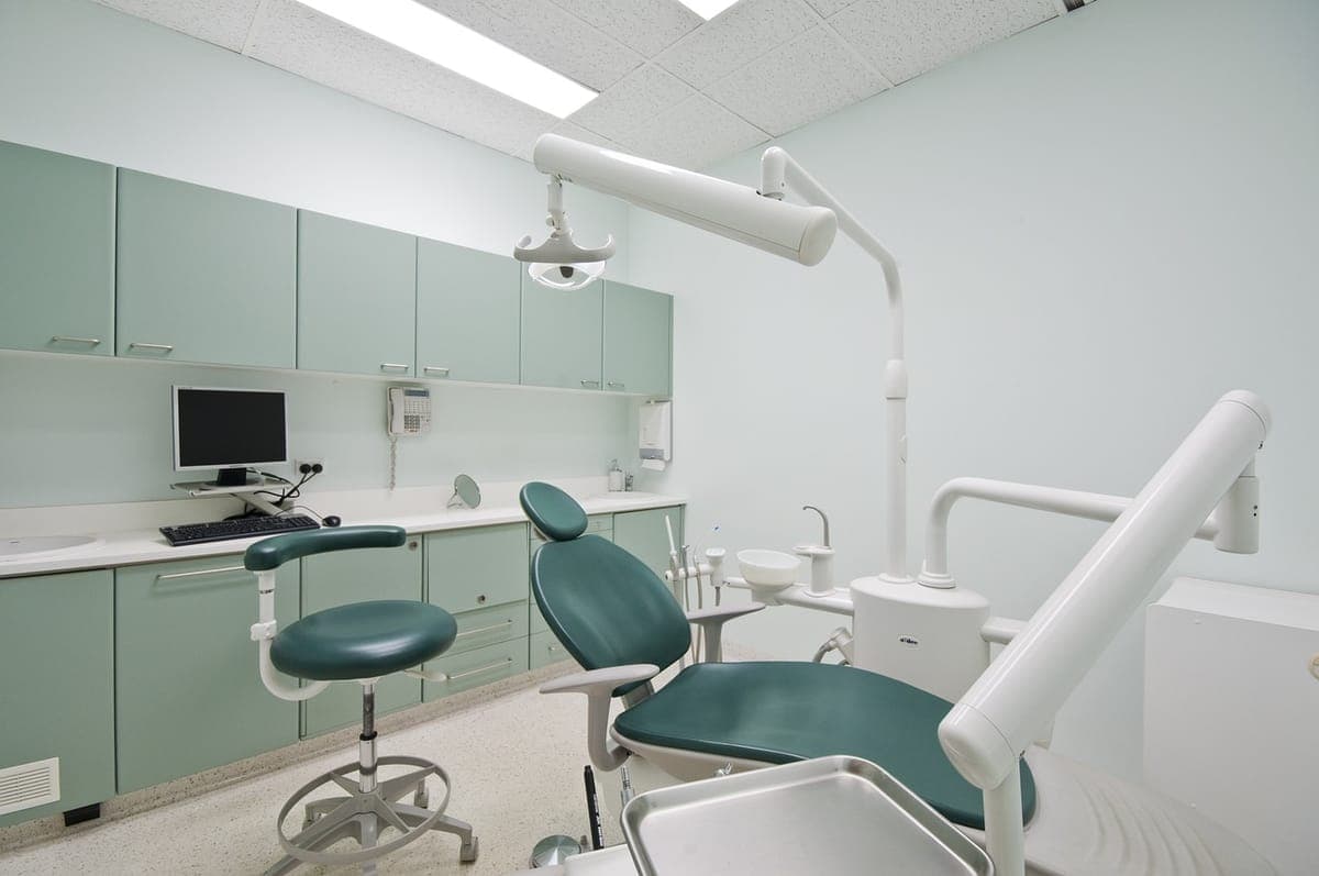 A patient smiling after treatment at Forever Smiles Dental Clinic